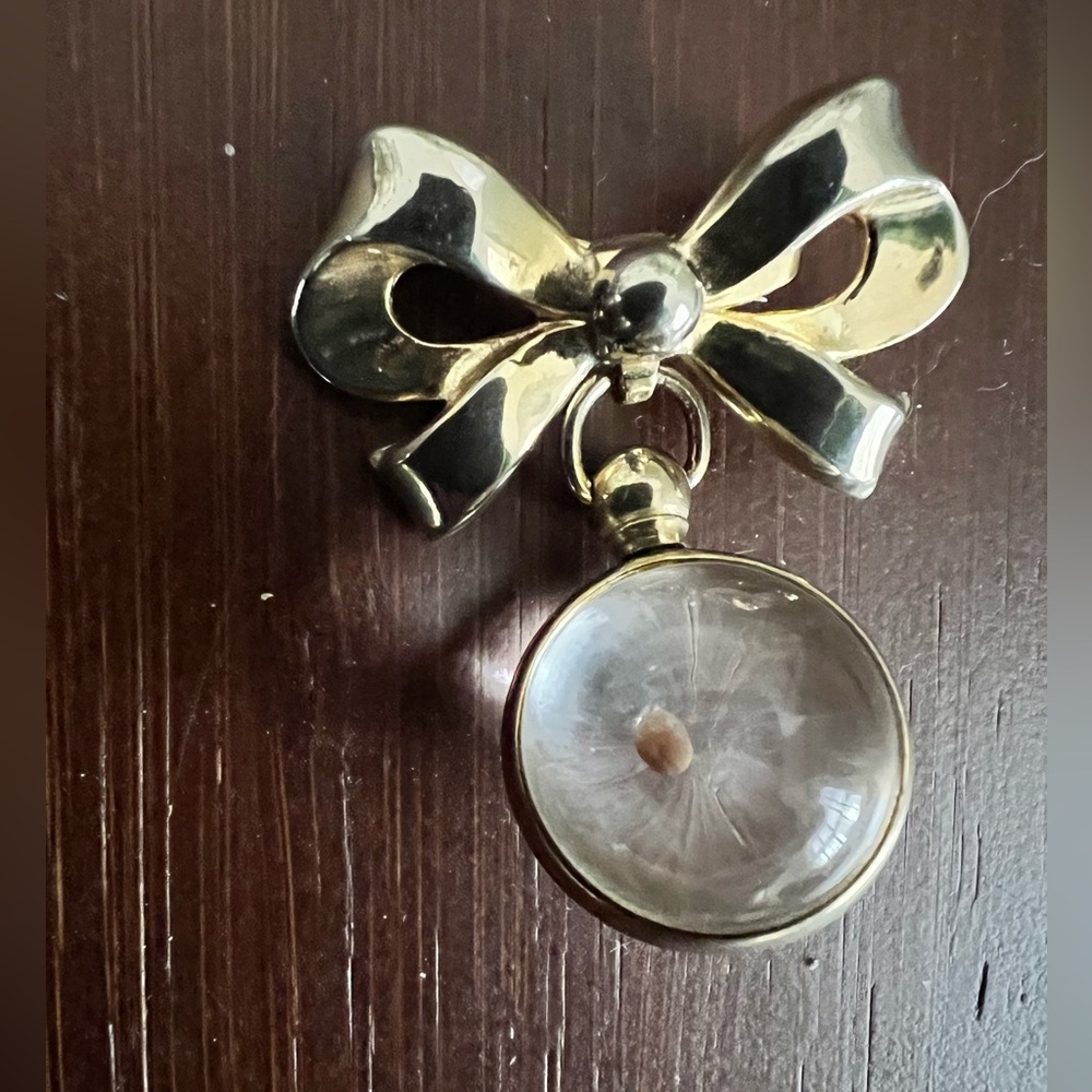 Vintage Coro signed bow brooch with dangling lucite sphere contains mustard seed